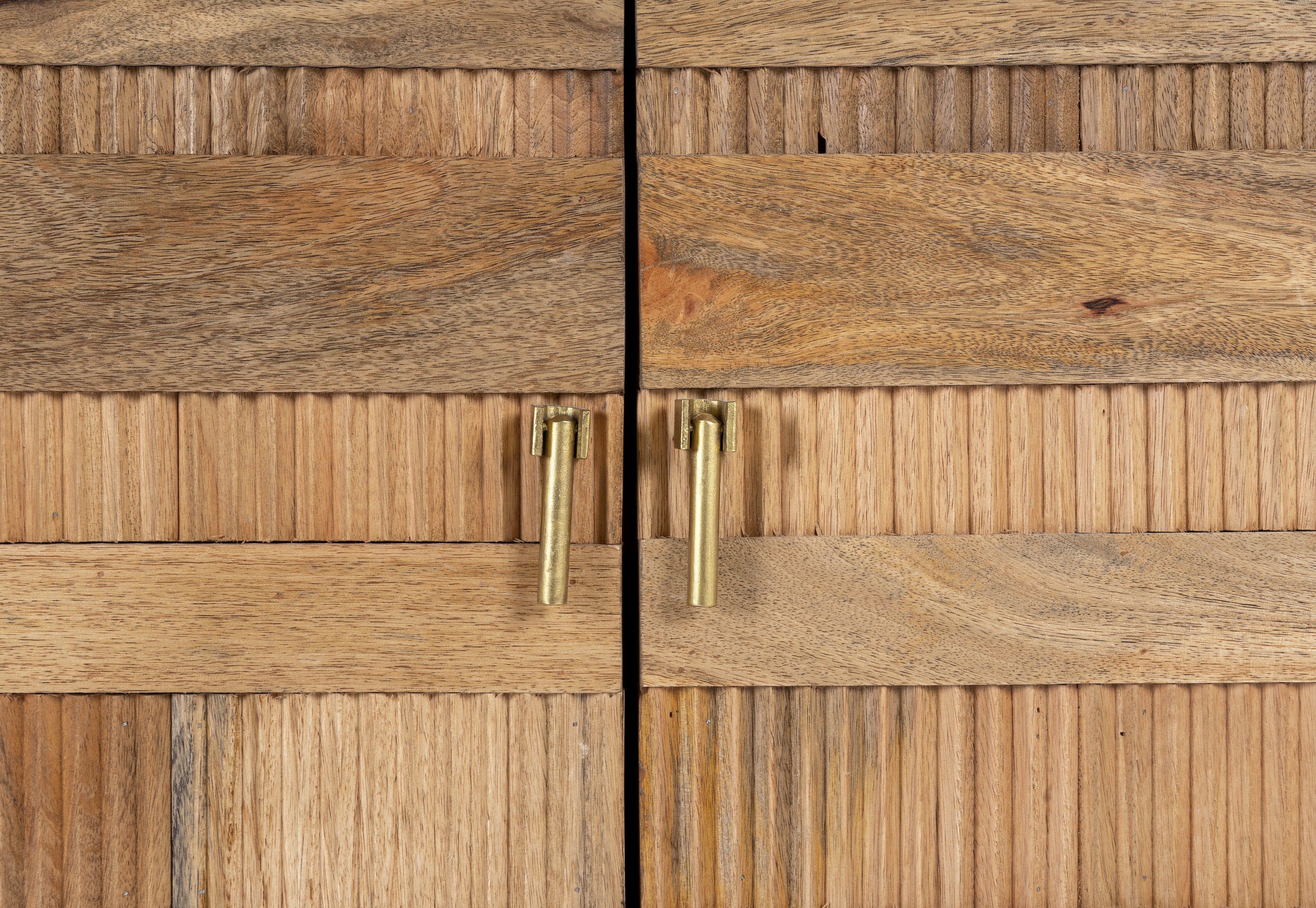 Close up image of a hand-carved mango wood cabinet with 3D line-striped design and natural finish—vintage furniture blending artisanal detail and timeless style.