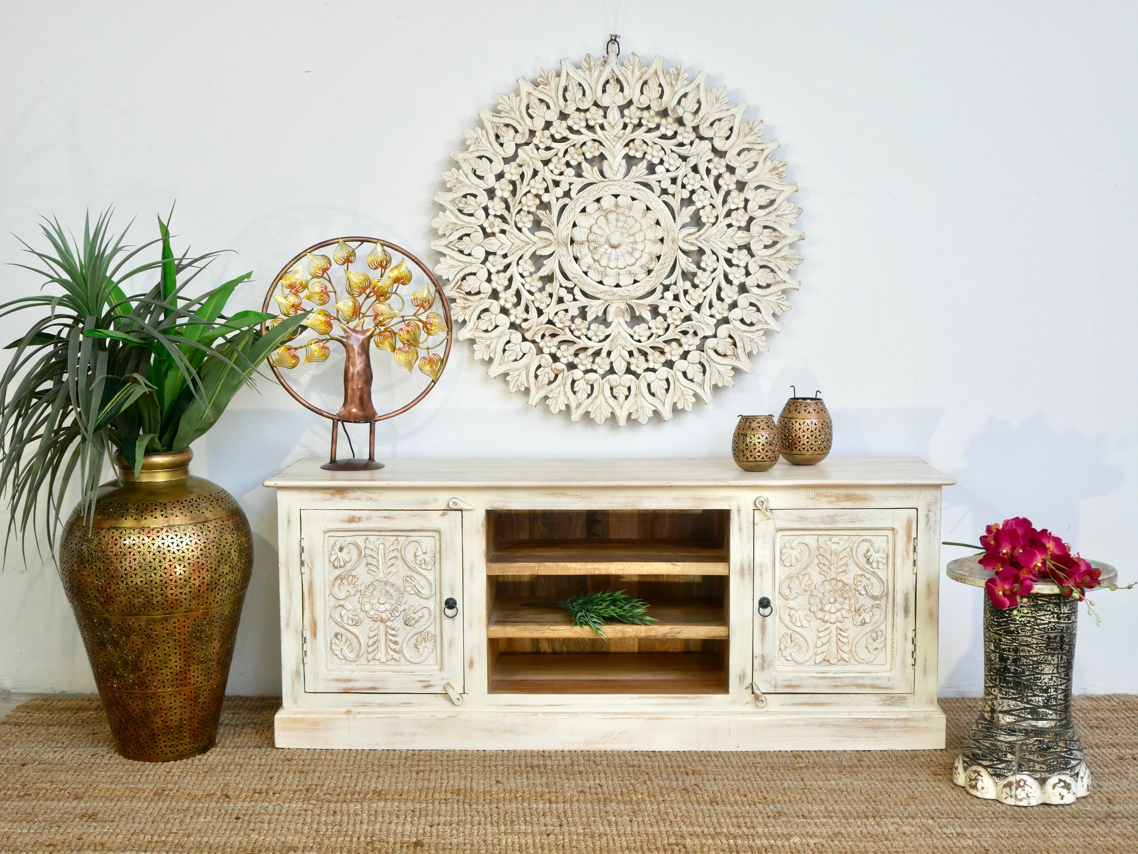 Hand carved lowboard made from mango wood with floral doors and open compartments; wooden TV unit, 150 × 60 × 40 cm.