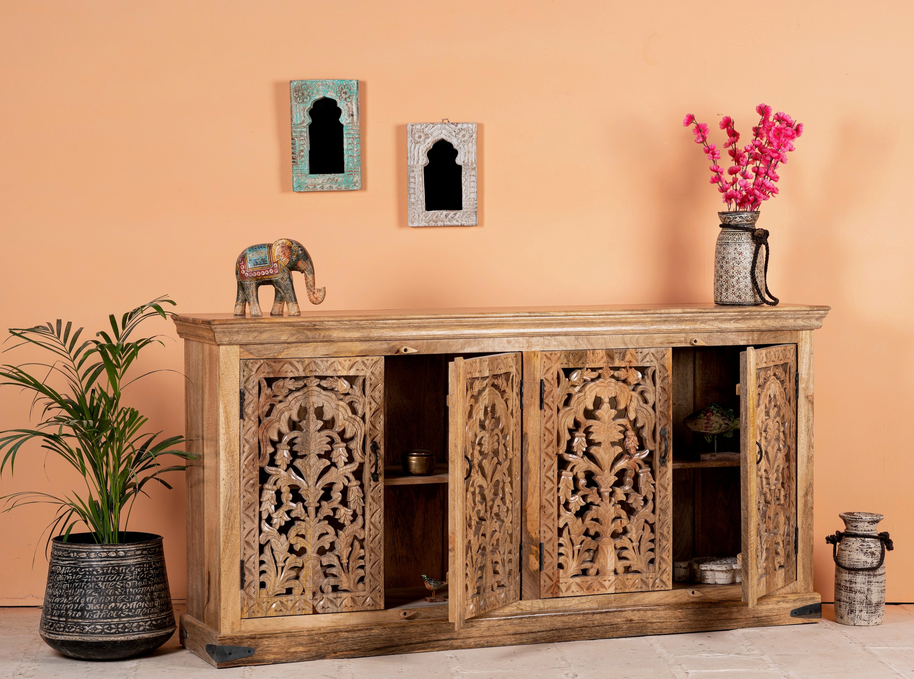 Open door image of a hand carved mango wood sideboard Bagodara with whitewashed finish and intricate Indian patterns; ideal for bedroom furniture or as a hand carved sideboard, 180 × 90 × 40 cm.
