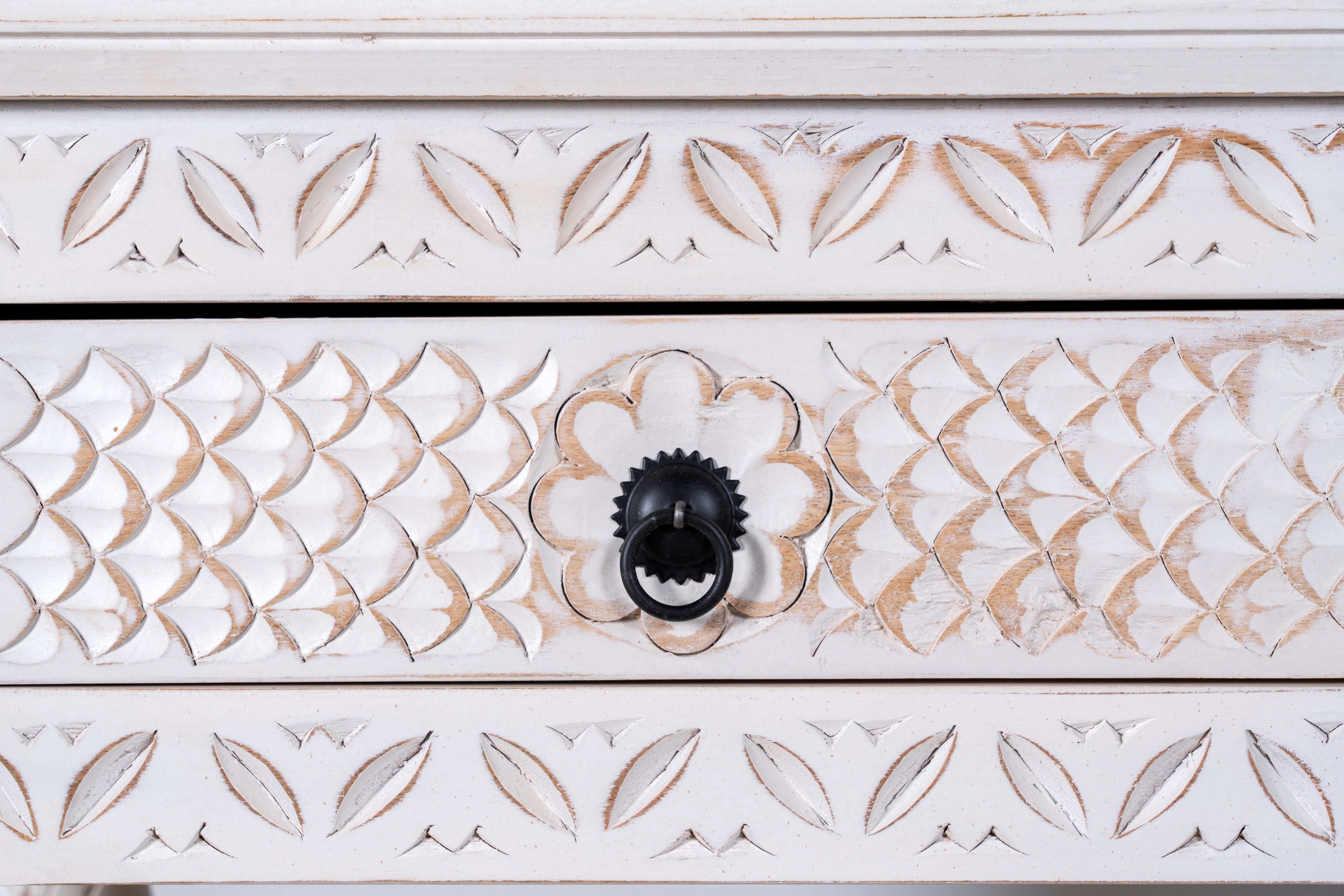 Close up image of a carved mango wood console table with floral ornamentation; rich, exotic mango wood furniture, 150 × 90 × 45 cm.