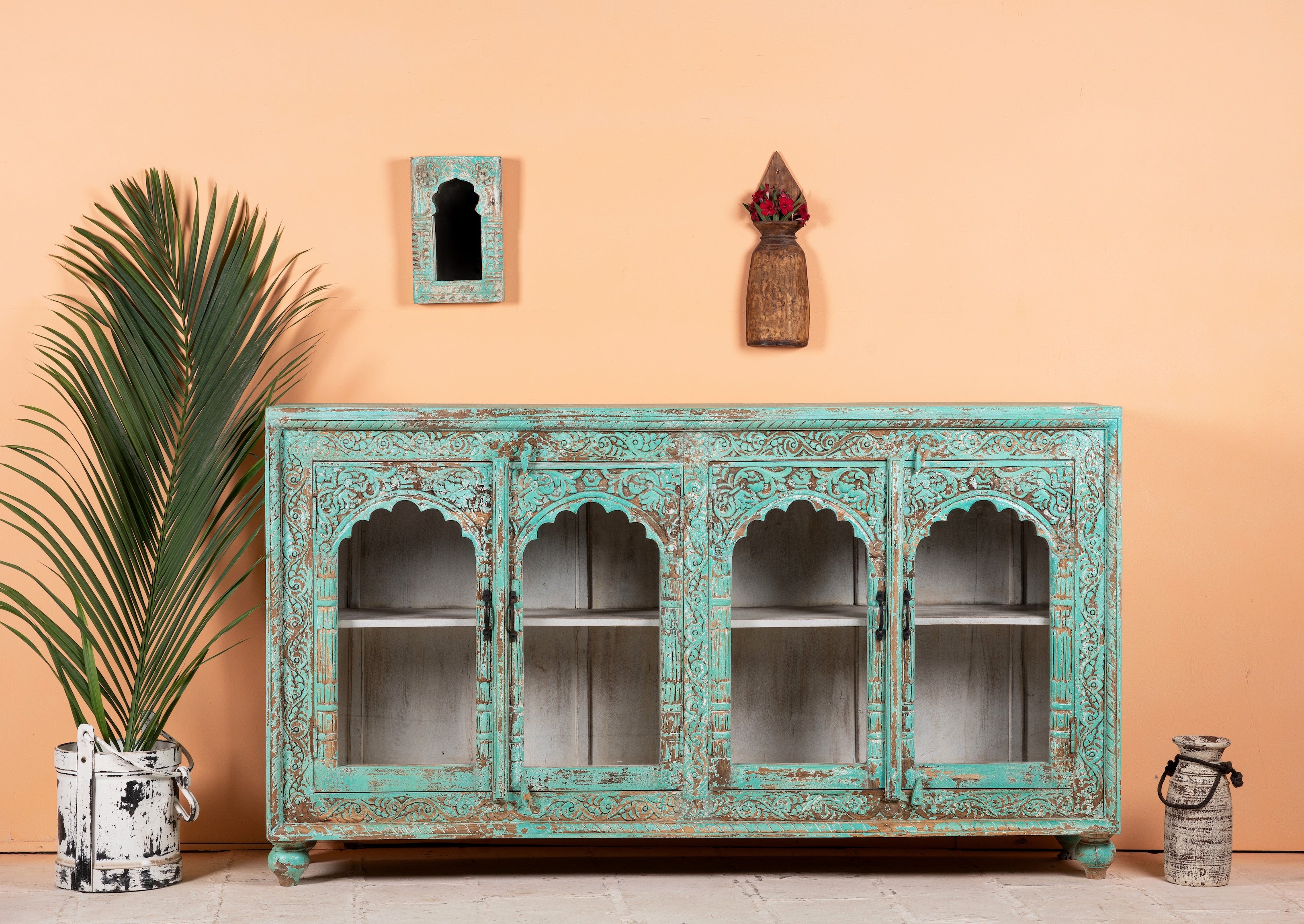Jesar wood carved sideboard in turquoise finish, a vibrant statement for a boho chic living room.