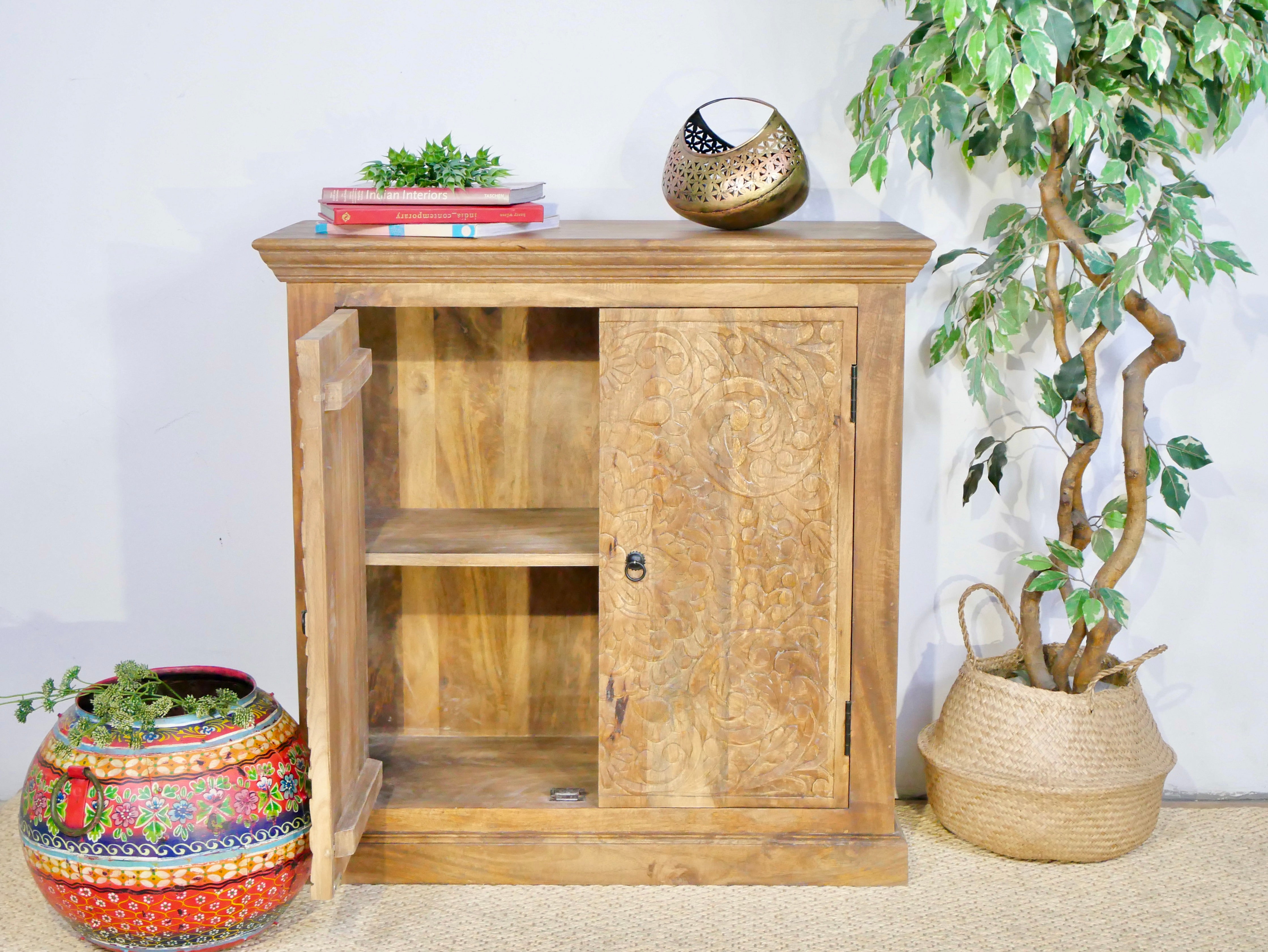 Side angle image with open door of a Mango wood cabinet with floral hand-carved doors in Mediterranean style, 90 × 90 × 40 cm – made from solid mango wood with unique grain and texture.