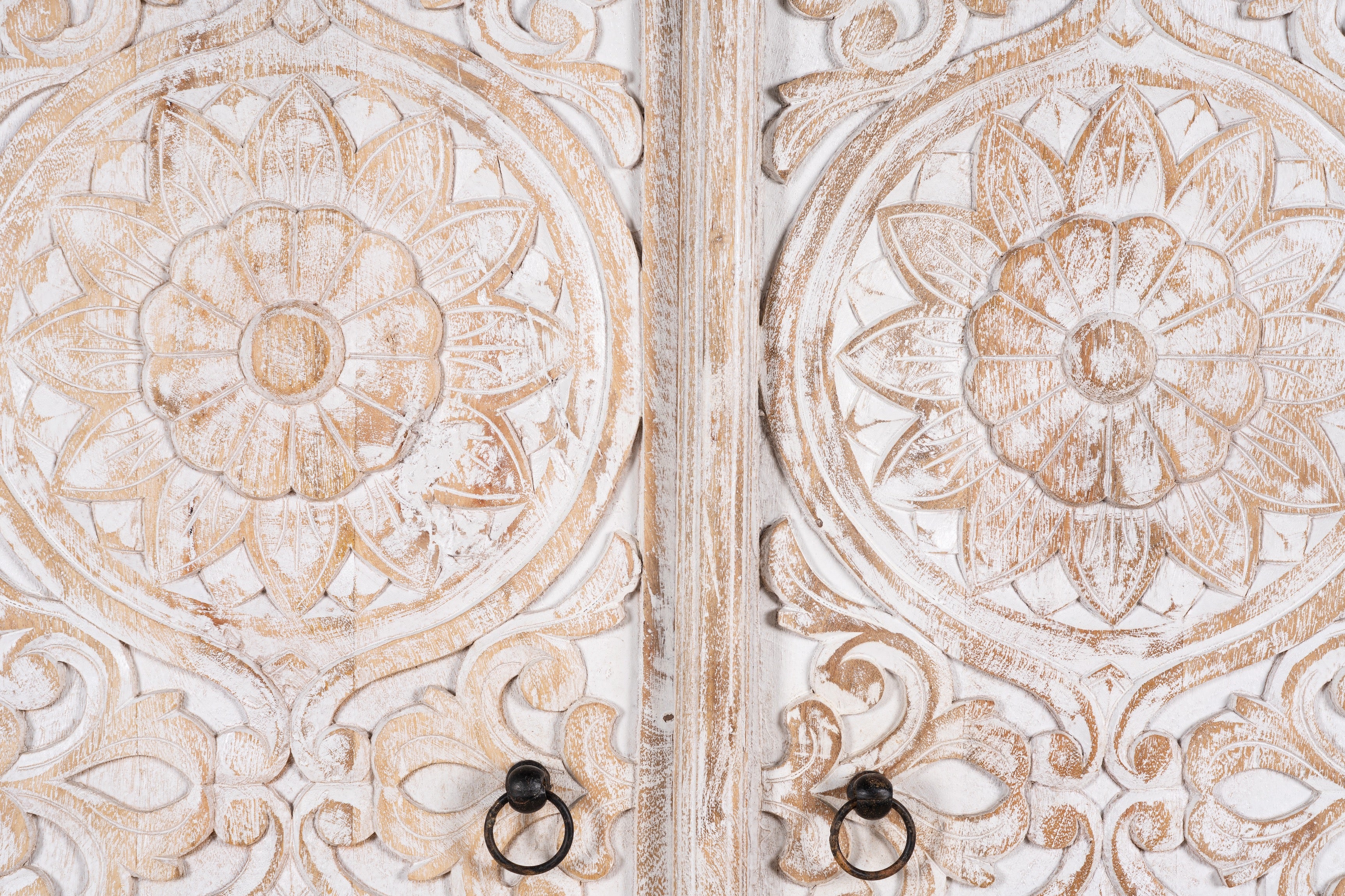 Close up image of a hand-carved mango wood wardrobe with whitewashed finish; wooden wardrobe perfect for living room furniture or bedroom storage, 180 × 90 × 40 cm.