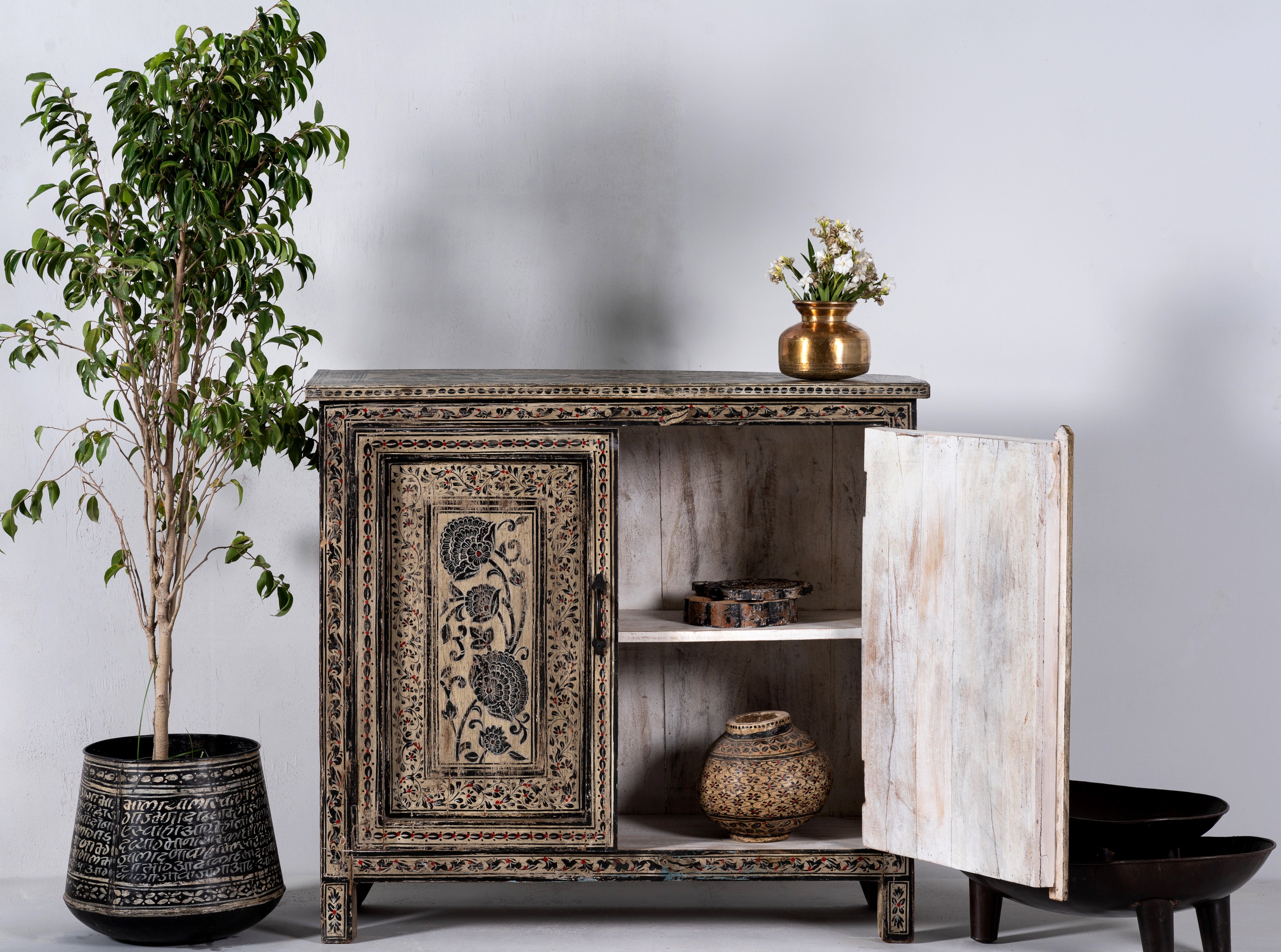 Open door image of a hand-painted cupboard made from reclaimed wood with Indian floral motifs; ideal for boho chic living room or unique furniture decor, 100 × 92 × 36 cm.