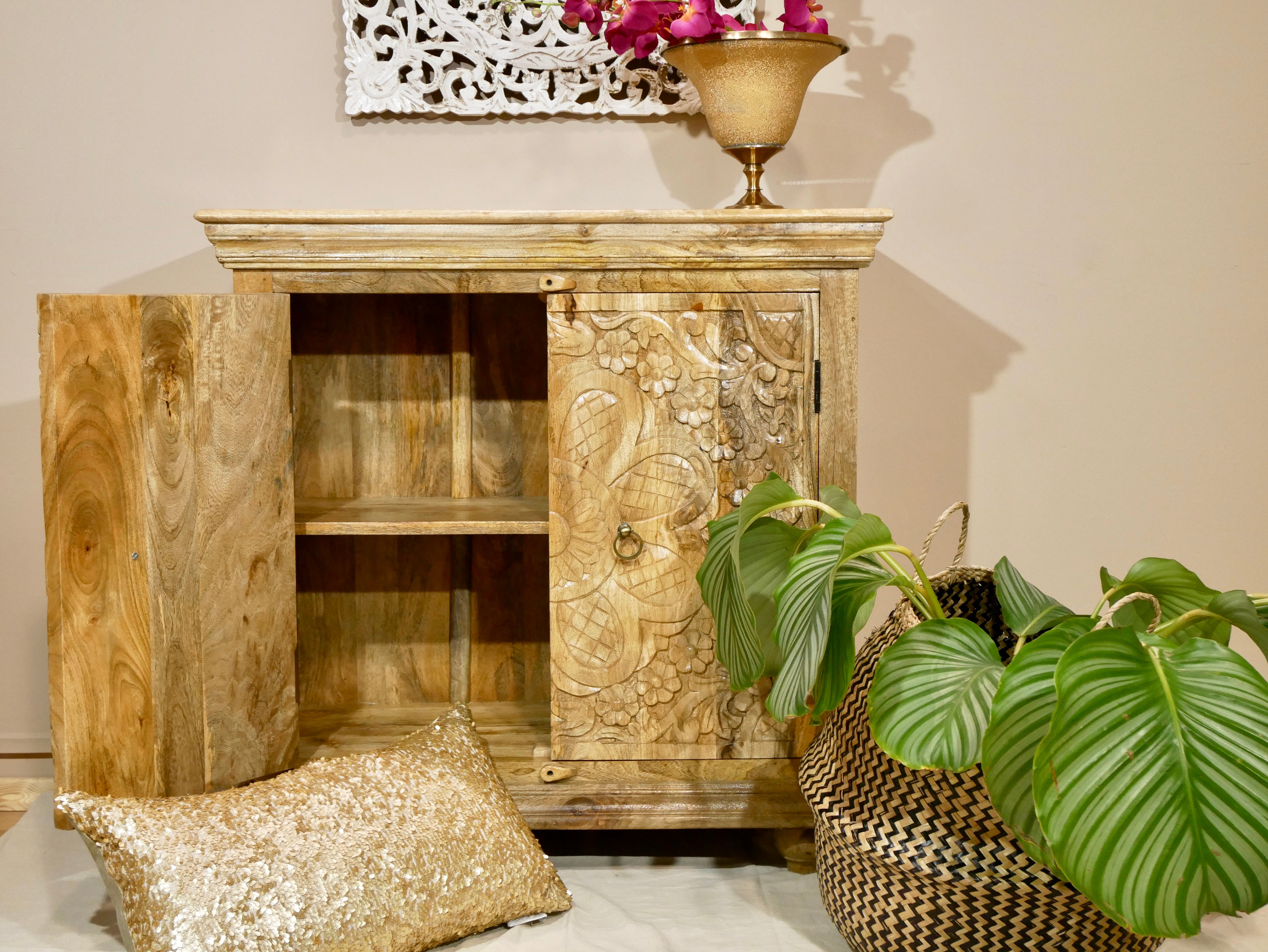 image with open door of a boho style mango wood furniture cabinet with hand-carved floral doors, Mediterranean-inspired design, 90 × 90 × 40 cm.