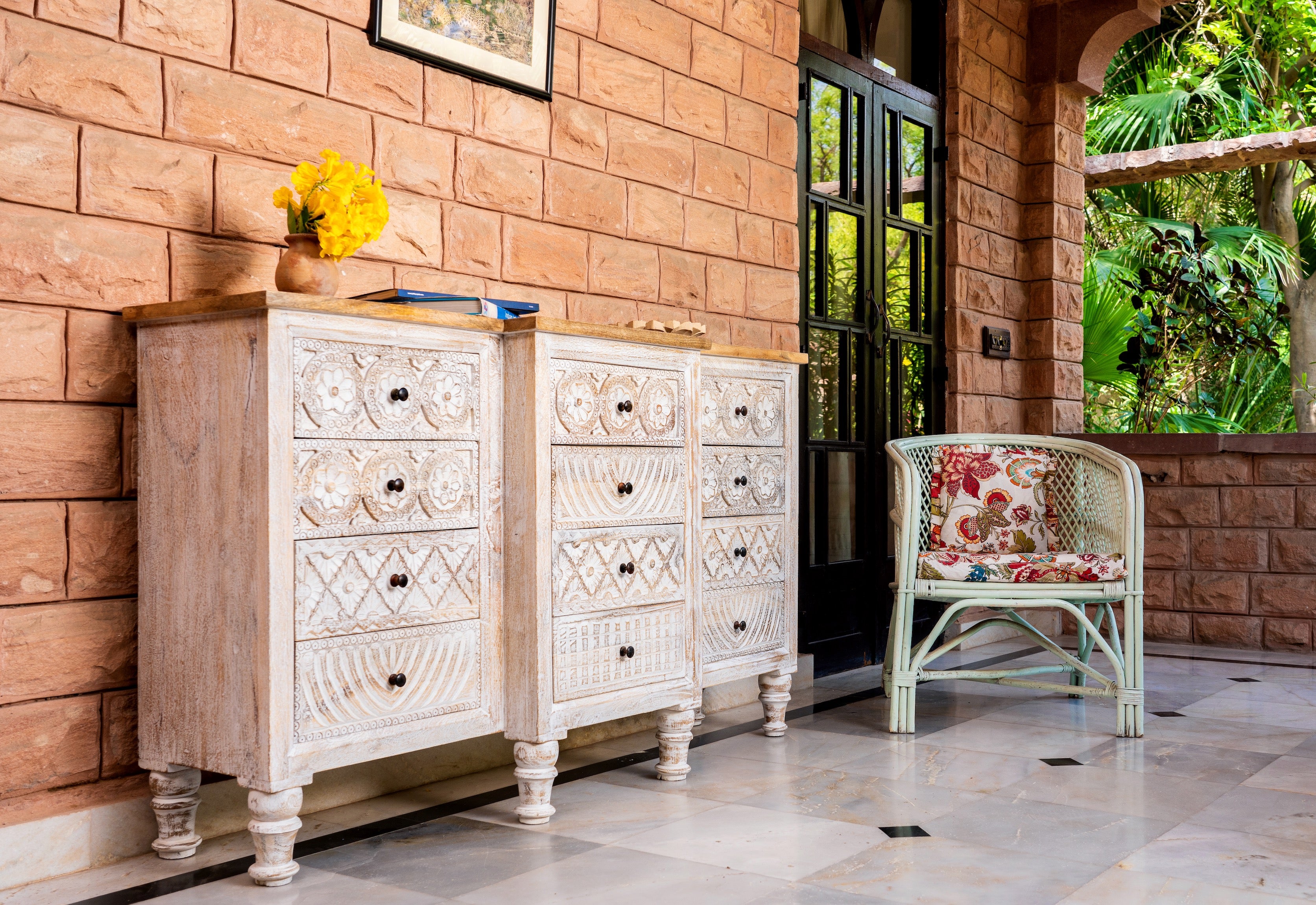 Hand-carved mango wood sideboard with lotus-inspired drawer motifs and whitewashed finish; a wood carved sideboard and unique furniture piece, 160 × 92 × 45 cm.