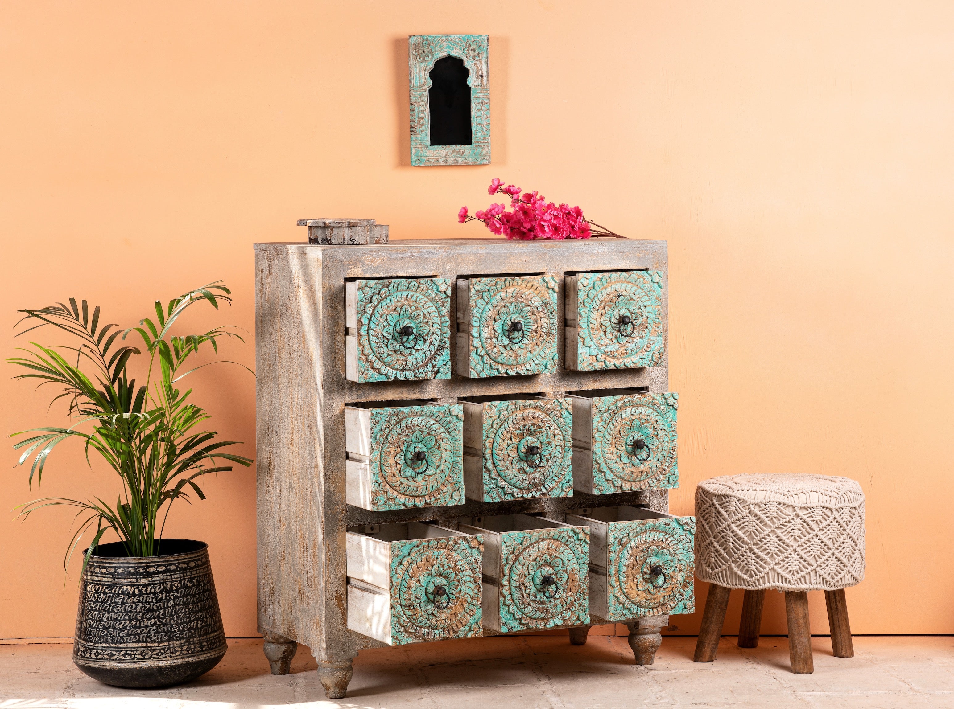 Open drawer image of a hand-carved mango wood vintage chest of drawers with greenwashed floral fronts and antique white finish; perfect for bedroom furniture, 90 × 100 × 40 cm.
