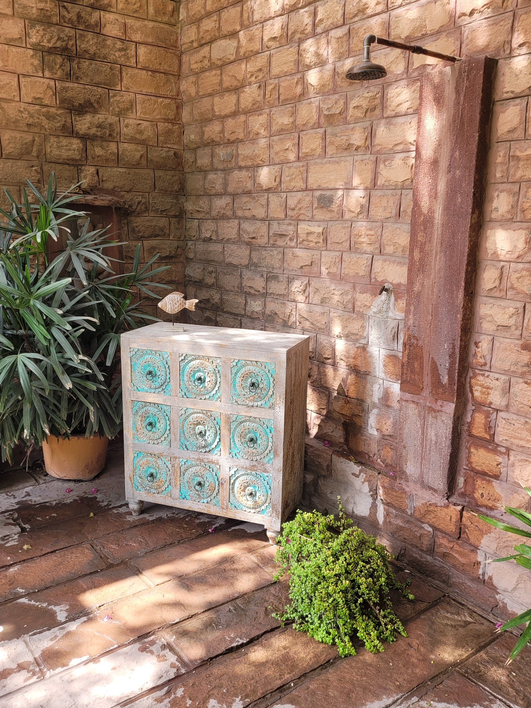 A reel showing a hand-carved mango wood vintage chest of drawers with blue body and whitewashed floral fronts; perfect as an entryway table vintage accent, 90 × 100 × 40 cm.