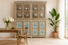 Lifestyle image with a and-painted reclaimed wood display cabinet with glass doors and floral blue peacock design – Aadrika model by Om Home & Garden