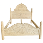 White background image of a beautiful hand-carved bed made from solid mango wood. Available in natural or whitewashed finish. Sustainable, artisan-crafted, and full of character.


