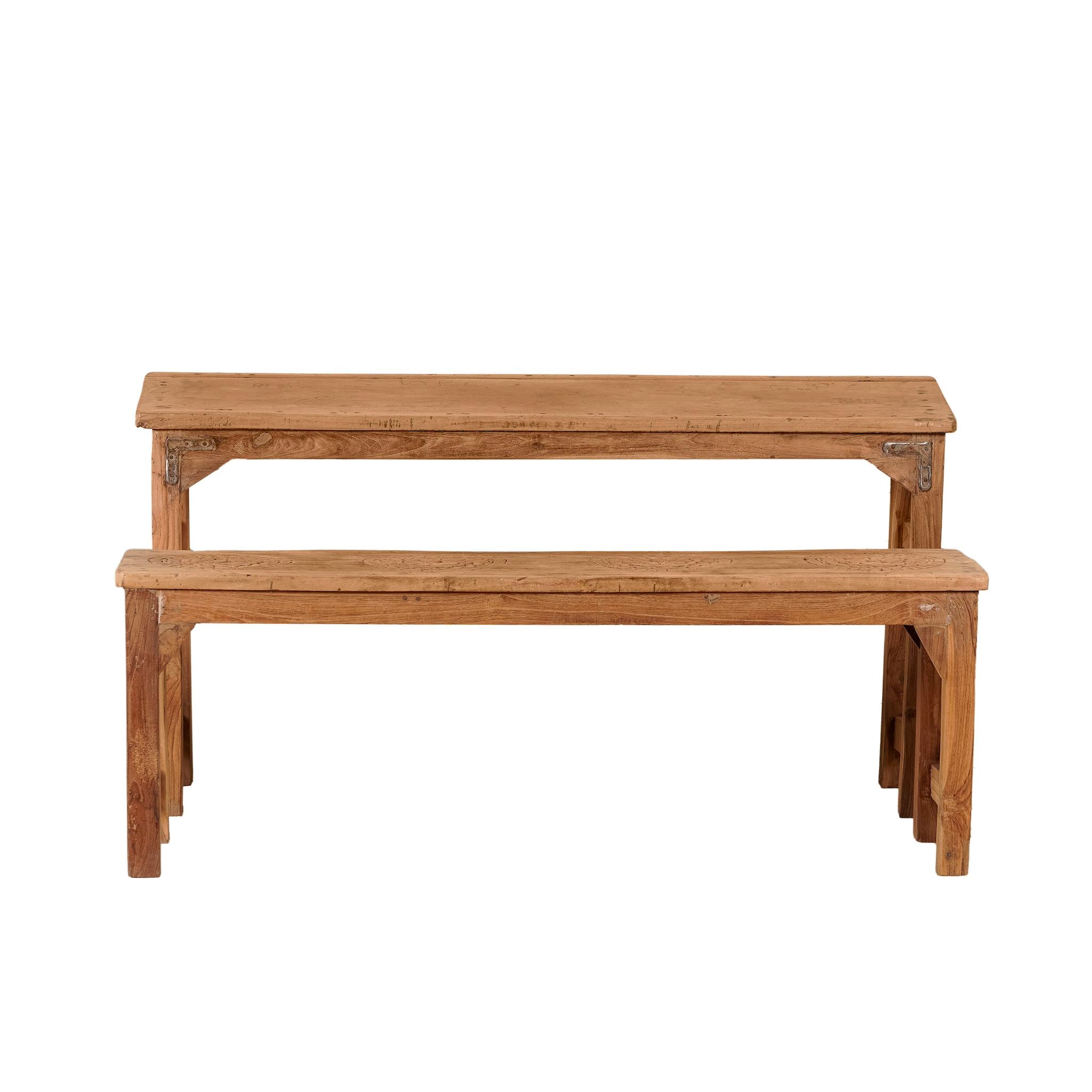 White background image of a vintage school bench set Adil from India, crafted from old teak wood, featuring a simple, sturdy design with a long bench and matching table in a natural, weathered finish, styled in a neutral-toned interior with rustic decor accents.
