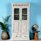 A refurbished antique teak wood showcase with ceramics. The showcase has a shabby chic white finish, features glass doors, and is adorned with Portuguese ceramic inlays.