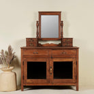 Restored antique cosmetic table in teak wood with hand-carved details; teak wood furniture for bohemian interiors, 105 × 56 × 148 cm.