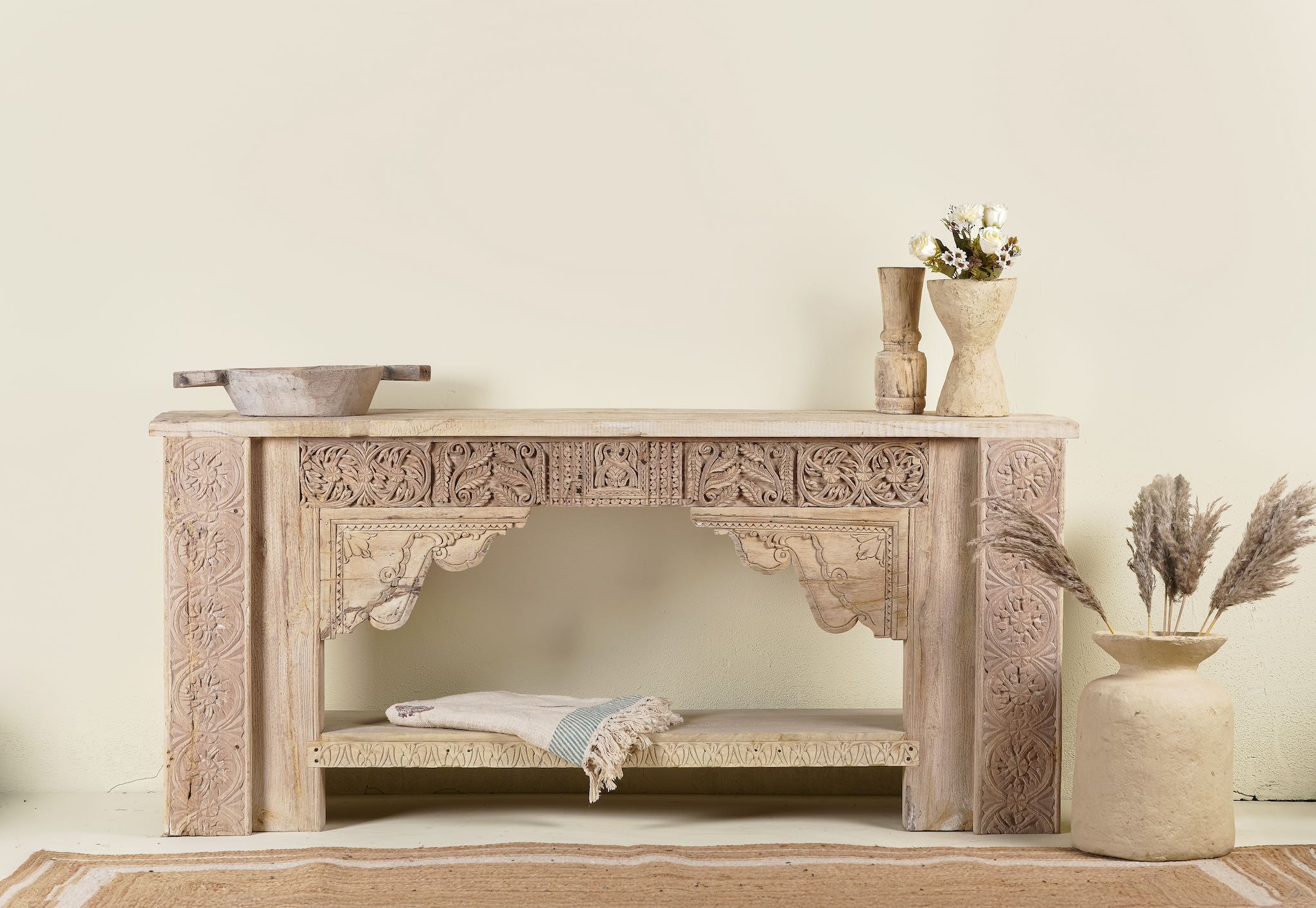 Antique teak console table made from reclaimed wood with hand-carved floral and geometric panels, 183 × 40 × 82 cm.