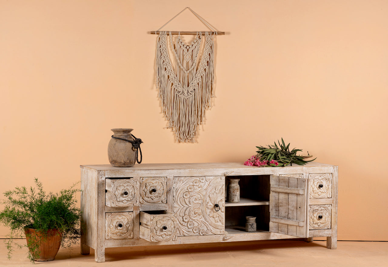 Open door and drawer image of a hand carved lowboard in mango wood, a stylish mango wood TV unit with whitewashed floral design.