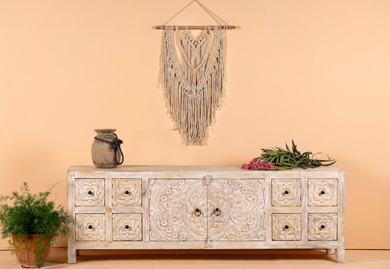 Ambalika hand carved lowboard in mango wood, a stylish mango wood TV unit with whitewashed floral design.
