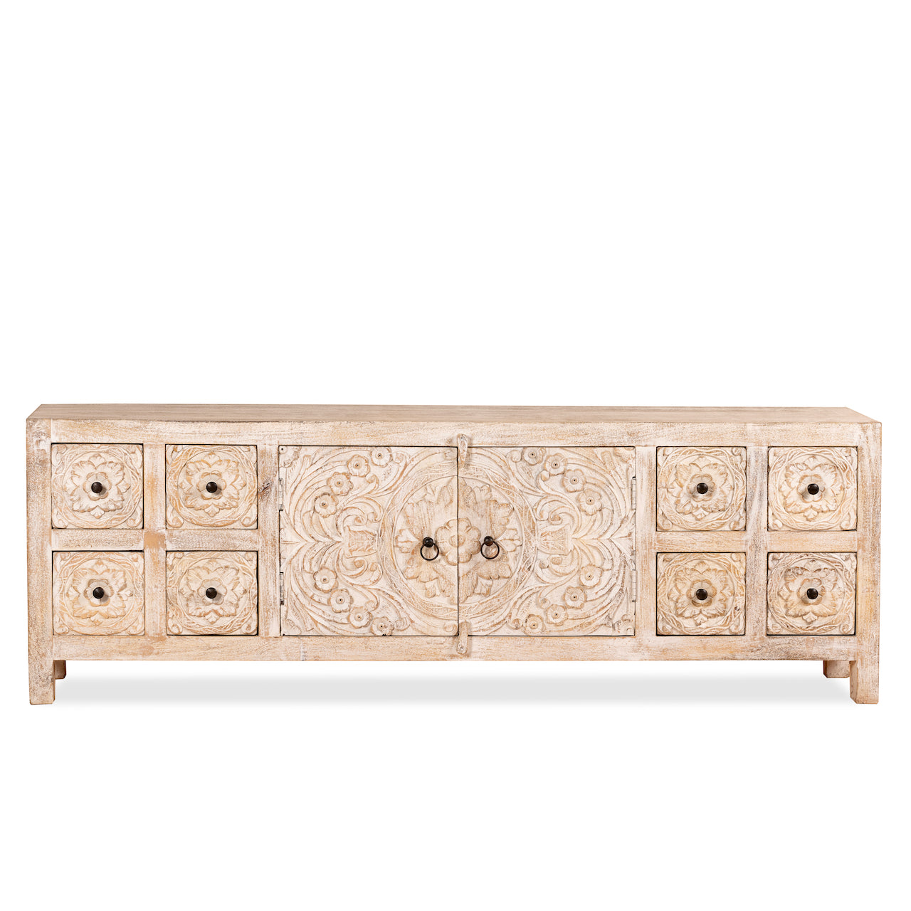 White background image of a hand carved lowboard in mango wood, a stylish mango wood TV unit with whitewashed floral design.