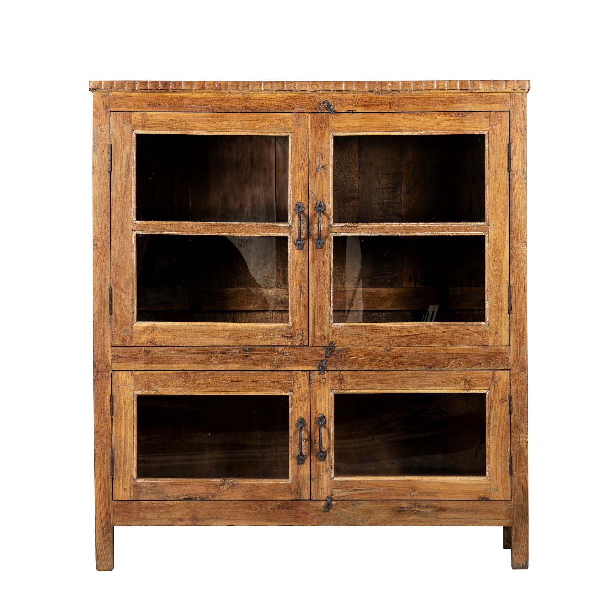 White background image of a reclaimed teak wood display cabinet with four glass-panelled doors – wooden showcase cabinet crafted as sustainable furniture with timeless appeal.