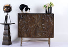 Hand-carved mango wood sideboard with brass-plated iron stand—an artisanal, minimalistic furniture piece combining natural warmth and modern elegance.