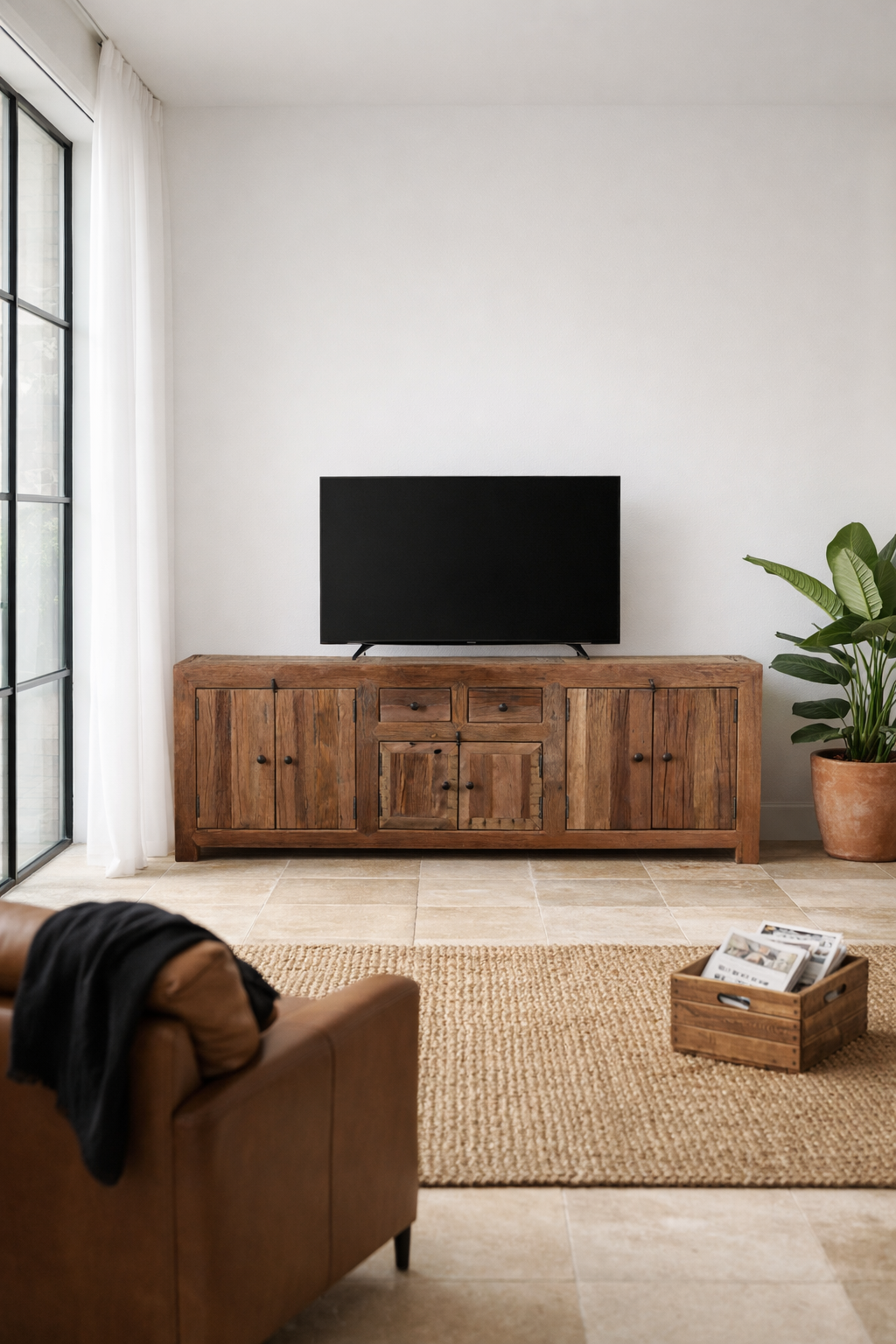 Lifestyle imagination with a reclaimed wood low board Ariana in rustic minimalistic style with four cabinets and two drawers. A sustainable furniture piece offering functional storage and natural texture for modern living spaces.