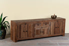 Side angle image of a reclaimed wood lowboard Ariana in rustic minimalistic style with four cabinets and two drawers. A sustainable furniture piece offering functional storage and natural texture for modern living spaces.