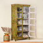Side view image with open doors of an and-painted floral showcase cabinet made from reclaimed wood with glass panelled doors and vintage rustic finish.