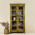 Front view image of an and-painted floral showcase cabinet made from reclaimed wood with glass panelled doors and vintage rustic finish.


