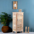 Side angle image of a reclaimed teak wood cabinet with slatted door and sandblasted finish, Ibiza-style, 122 × 56 × 40 cm.