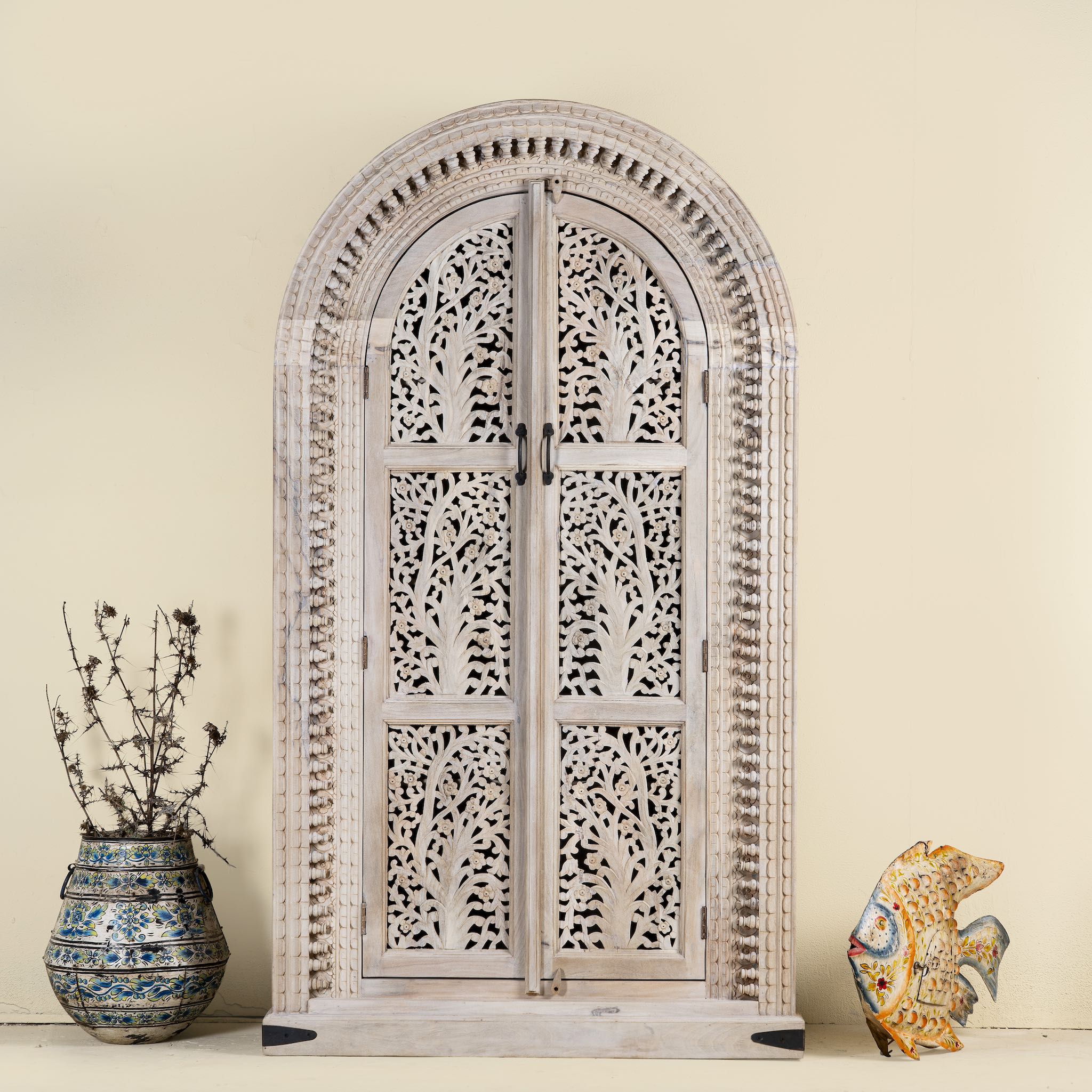 Artha cabinet with Tree of Life carving, a unique furniture piece from our mango wood furniture collection.