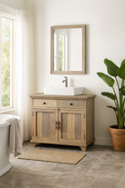 Lifestyle imagination of a reclaimed wood sandblasted cupboard with 2 drawers and 2 doors; sustainable bathroom furniture, 100 × 50 × 80 cm.