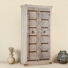 Decorative wooden cabinet with intricate patterns on a beige background