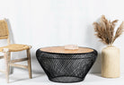 Large round metal base coffee table with recycled wooden top and woven iron base; minimalistic style coffee table, 100 cm diameter, 45 cm height.
