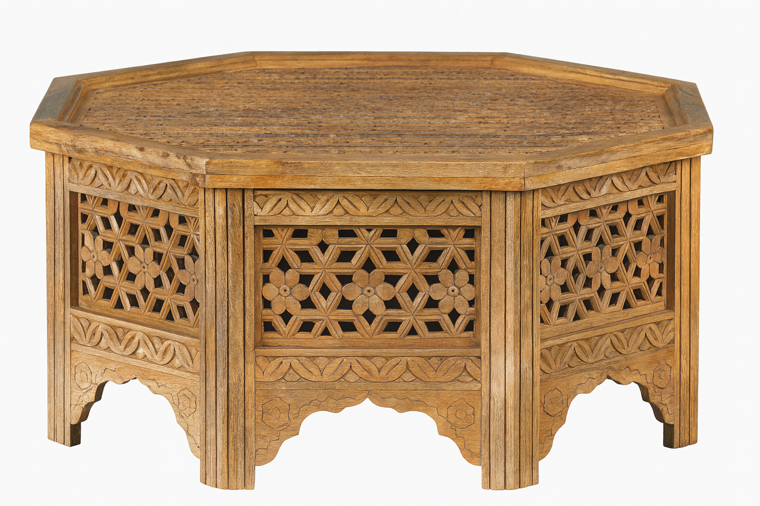 White background image of a octagonal mango wood coffee table with intricate floral and geometric carvings; durable hand-carved coffee table, 90 × 90 × 46 cm.