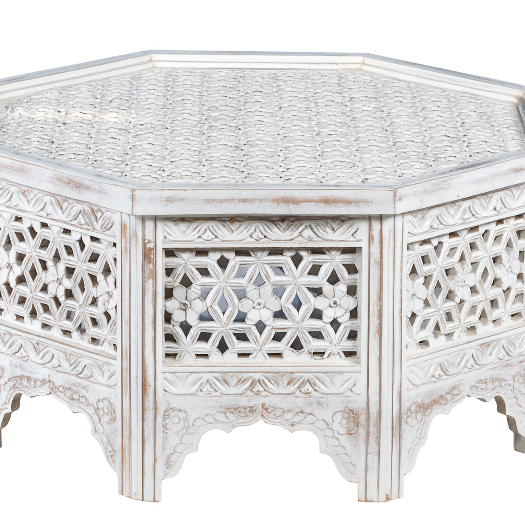 White background image of a octogonal mango wood coffee table with floral carvings and white wash finish; hand-carved and rustic, 90 × 90 × 46 cm.