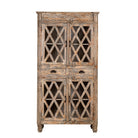 White background image of a handcrafted showcase cabinet made from reclaimed wood, featuring diamond-pattern glass pane doors, a crackled paint finish in earthy tones, two drawers, and vintage-inspired detailing.