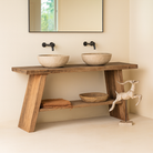 Lifestyle imagination of a driftwood console table made from reclaimed wood, with lower shelf and weathered finish; sustainable furniture for entryways, 200 × 32 × 80 cm.