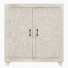 White background image of a white washed wooden cabinet made from mango wood with hand-carved Indian floral patterns, rustic Mediterranean-style furniture, 90 × 97 × 40 cm.