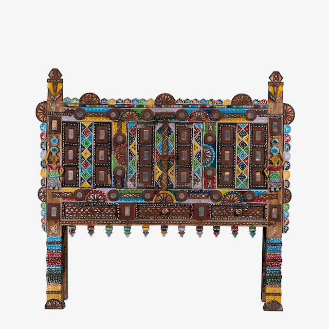 White background image of a restored antique Indian Damchia chest crafted from teak wood with original paint, metal fittings, and mirror inlays—an authentic piece of unique Indian furniture for traditional or bohemian interiors.