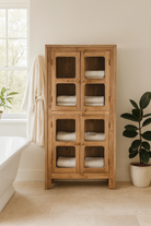 Lifestyle imagination of Chander tall vitrine with reclaimed teak door panels, a refined piece of teak wood furniture for living room furniture collections.