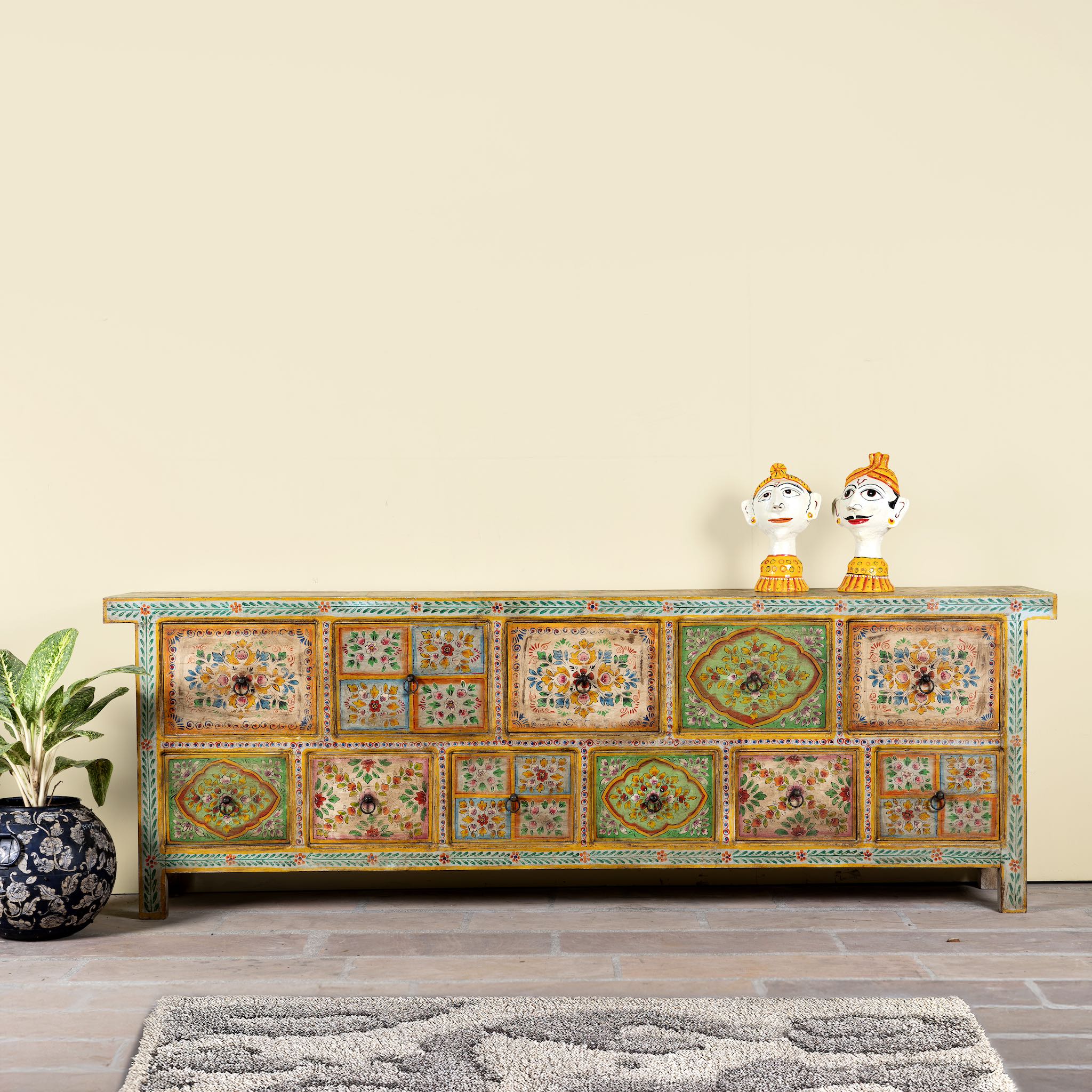 Hand painted mango wood chest of 11 drawers with floral motifs; artisanal mango wood furniture and hand painted furniture, 250 × 41 × 85 cm.