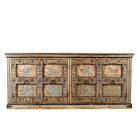 White background image of a vintage sideboard made from teak wood, hand-painted with traditional Indian motifs including elephants, camels, horses, and floral patterns in muted teal and earthy tones, featuring detailed borders and a distressed finish. 