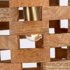 Close up image of a wooden vintage ceiling lamp made from natural mango wood with brass-clad edges and grid design – a refined piece of mango wood lighting for kitchens, dining areas, or entryways.