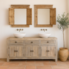 Lifestyle image of a sustainable bathroom sideboard made of reclaimed wood with four cupboards and three drawers, rustic finish, 180 × 40 × 90 cm.