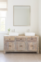 Lifestyle image of a sustainable bathroom sideboard made of reclaimed wood with four cupboards and three drawers, rustic finish, 180 × 40 × 90 cm.