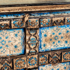 Close up image of a cupboard made from an antique Indian old door, hand painted cabinet with blue floral details; boho style teak wood furniture, 115 × 50 × 104 cm.