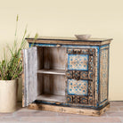 Open door image of a cupboard made from an antique Indian old door, hand painted cabinet with blue floral details; boho style teak wood furniture, 115 × 50 × 104 cm.