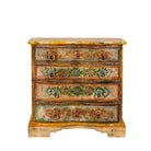 White background image of a hand-painted chest of drawers made from reclaimed wood, featuring a vibrant floral motif across its four drawers, with a distressed finish and colourful detailing that highlights its vintage, artisanal charm.
