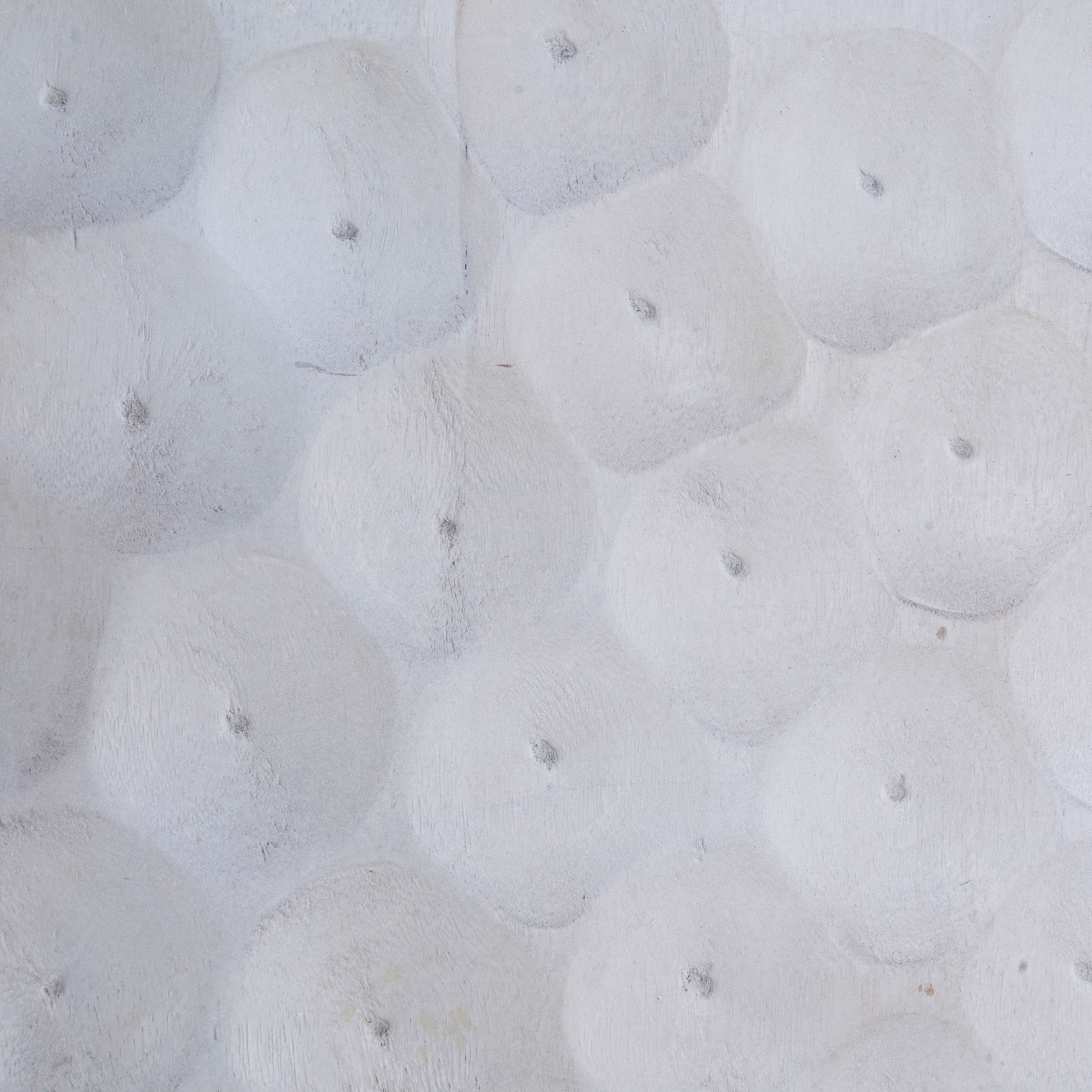 Close up image of a carved wood furniture cupboard in white mango wood with hammered pattern, brass iron base, 88 × 43 × 122 cm.