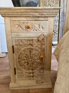 Pair of hand-carved nightstands made of sandblasted mango wood with floral Mediterranean patterns and one drawer– Hriday bedside tables by Om Home & Garden