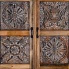 Close up view of a Rustic elegant mango wood Cabinet with floral hand carvings, 4 doors and 2 drawers.